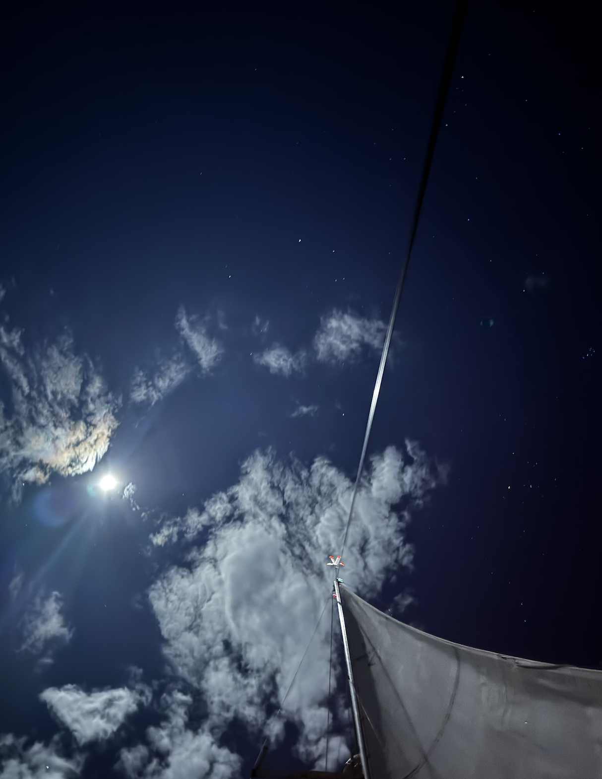 stars in the sky while sailing under the full moon