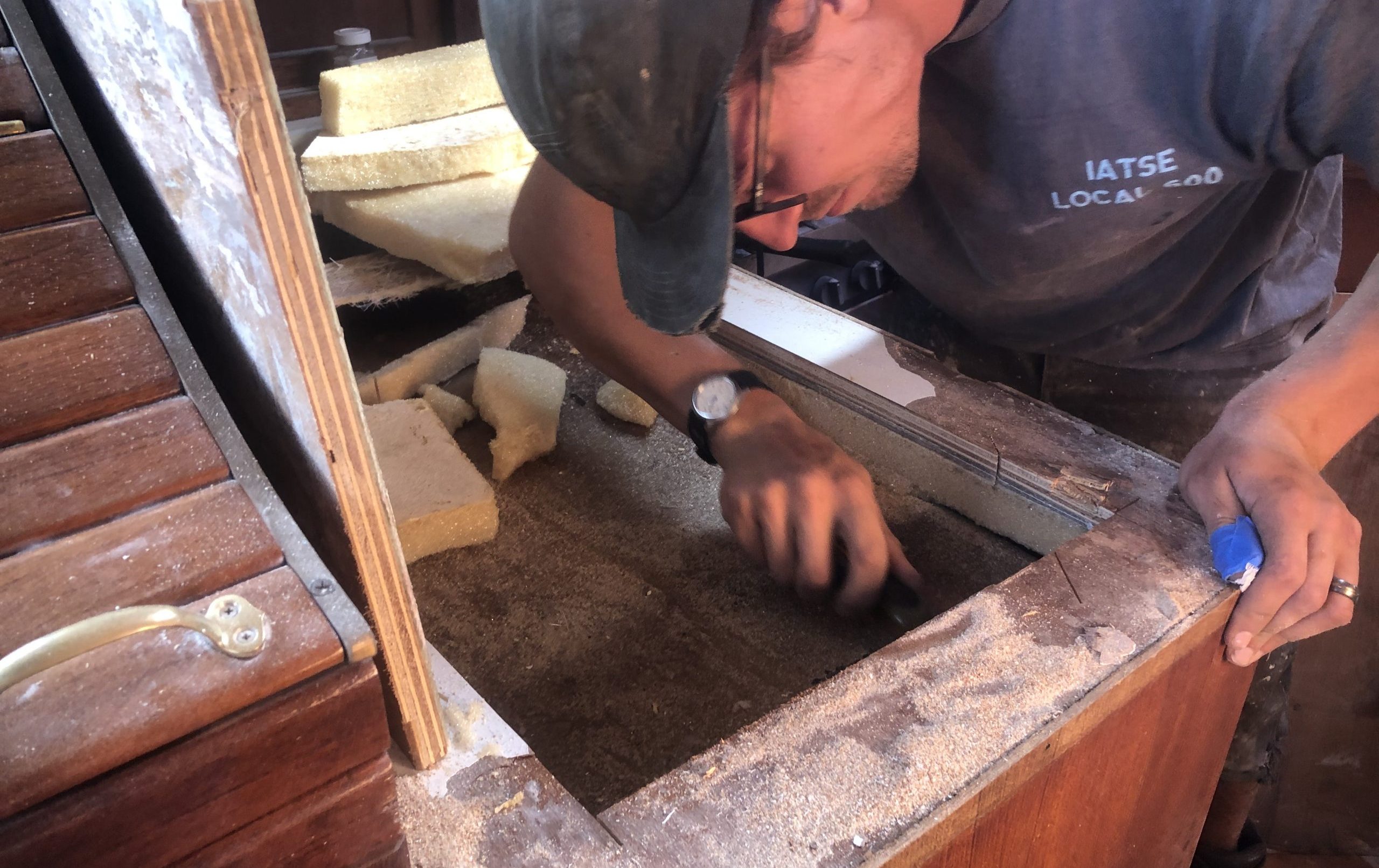 Chris working in our boat's refrigerator
